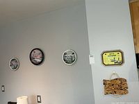 Overall wall view showing four decorative plates and two wall pieces