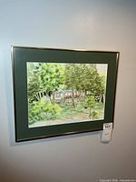 Framed watercolour painting on wall