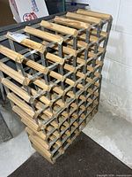 Stacked pair of metal and wood wine racks front view