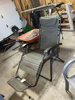 Front angled view of zero gravity chair showing footrest and frame