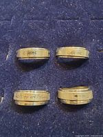 All four spinner rings displayed on felt backing