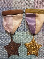 Both medals front view showing ribbons and star shapes