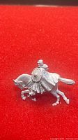 Side view of unpainted metal Boromir on horse