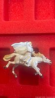 Overall view of painted Gandalf on horse against red foam