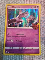 Front of Mewtwo card showing artwork, HP, moves and border