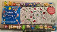 Front of sealed set showing coloring book, pencils with eraser toppers