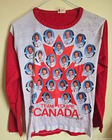 Front view of shirt hanging, full graphic visible