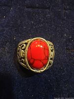 Front view of ring showing red turquoise cabochon and band detail
