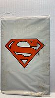 Front of sealed polybag with Superman logo