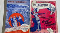 Front covers of both sheet music booklets