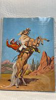 Front cover showing Roy Rogers on palomino horse in desert