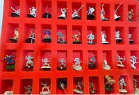 Foam tray with multiple Warhammer miniatures in various states of paint