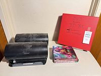 overall lot view with two disc organizers, red binder, three boxed sets