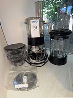 Complete Cuisinart SmartPower Duet appliance with blender jar, food processor bowl, lids, blades and accessories