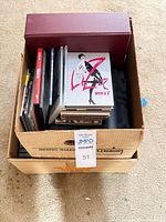 Box containing binders, cased DVDs and “Liza With A Z” set