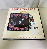 Stack of LPs with Reckoning on top and Touch of Grey 7" single