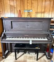 Full view of Gulbransen upright piano with bench, lamp and metronome on top