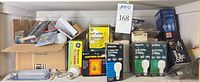 Shelf showing boxed and loose bulbs from multiple brands
