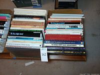 Two boxes filled with stacked songbooks showing spines of major titles