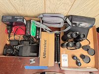 Overview of all cameras, binoculars, tripod, cases and accessories in lot