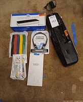 Group shot of all items including dock box, cable ties, headphones, JSAUX box, Sony boombox