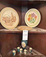 Overall lot showing three plates, pitcher, five mugs