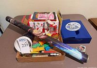 Overview showing rolled poster, Jelly Belly machine box, Roger Rabbit plush, Pez dispensers and miscellaneous items