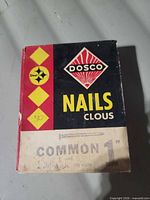 Front of Dosco nail box showing branding and size