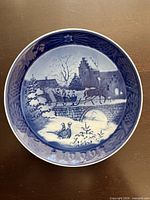 Front view of 1999 Royal Copenhagen Christmas plate showing full design