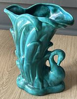 Front view showing swan relief and flared rim