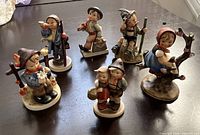 Group shot of all six Hummel figurines