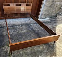 Overall view of assembled walnut double bedframe with headboard, footboard and siderails