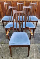 Front view of all six chairs showing design and upholstery