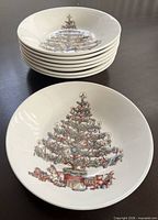 Stack of seven bowls plus one displayed to show interior pattern