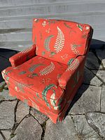 Front angled view of upholstered armchair showing color and pattern