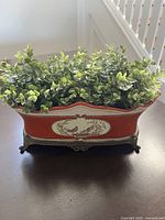 Overall view of planter with faux plants