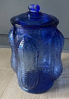 Full view of cobalt blue Planters jar with lid