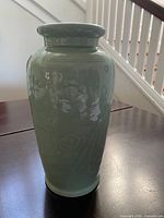 Full front view of celadon vase showing height and glaze
