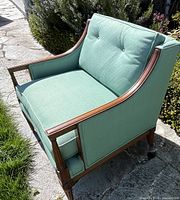 Front angled view showing frame, upholstery, cushion