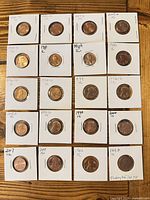 Full layout of 20 of the 25 flipped cents showing handwritten dates/mint marks
