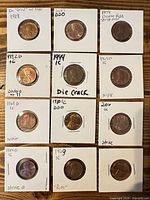 Full layout of 12 flipped Lincoln cents with handwritten error notes