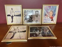 Group shot of all five framed autographed photos