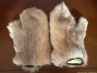 Top view of both mittens showing fur exterior