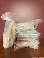 Two plastic bags filled with stacked greeting cards