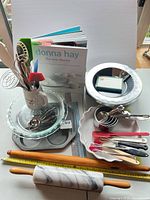 Overview of all bakeware, utensils, rolling pins, pans, measuring sets and cookbook