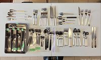 overview of all flatware pieces laid out on table