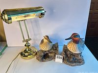Lamp and pair of duck bookends front view