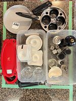 Overall lot showing pans, poacher, Red Copper cooker, porcelain dishes, glass bowls and shakers in bins