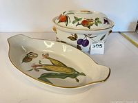 Covered casserole with lid and oval serving dish front view