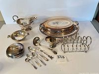Group view of all silver-plated pieces laid out